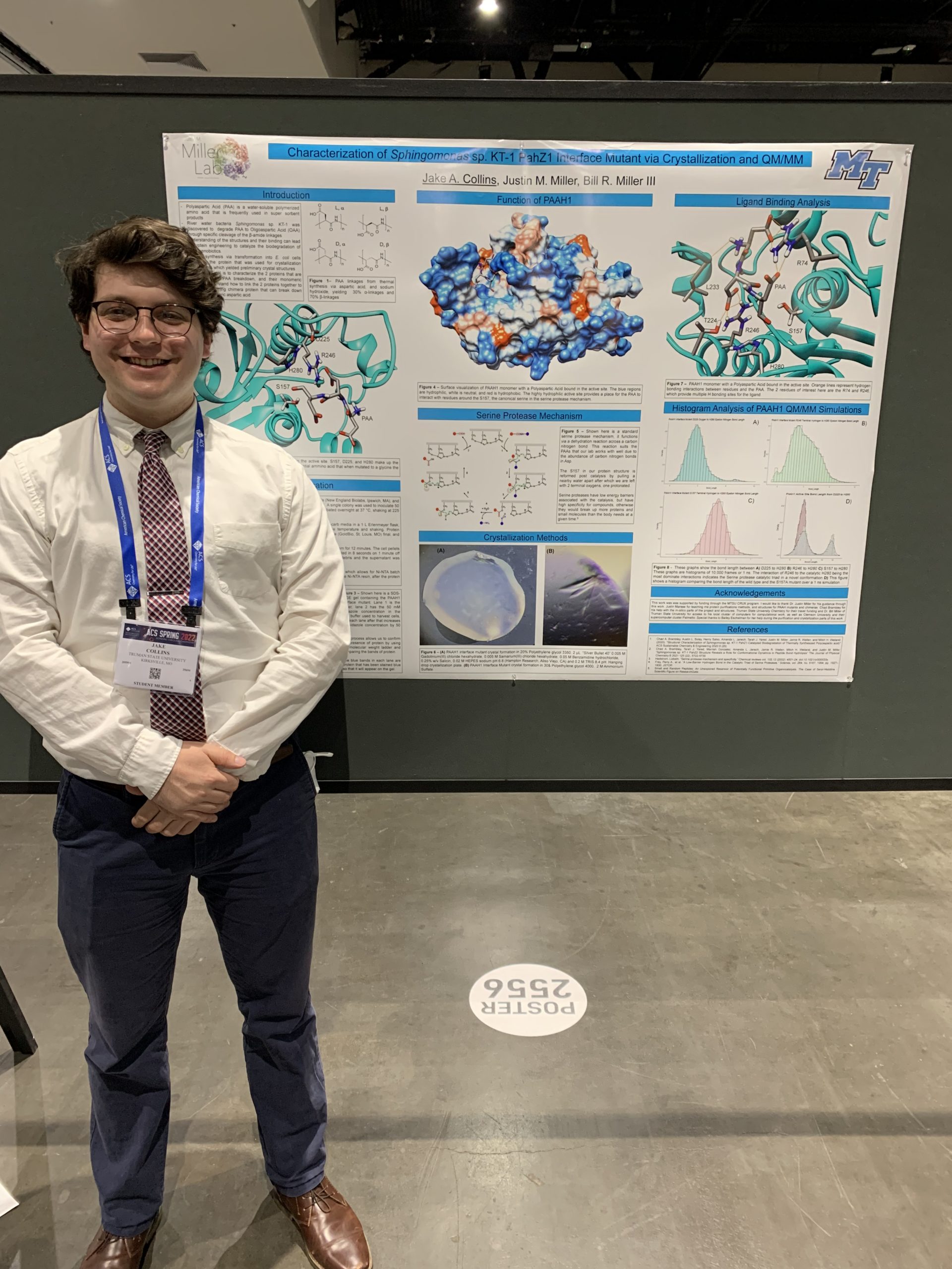 Jake in front of his research poster
