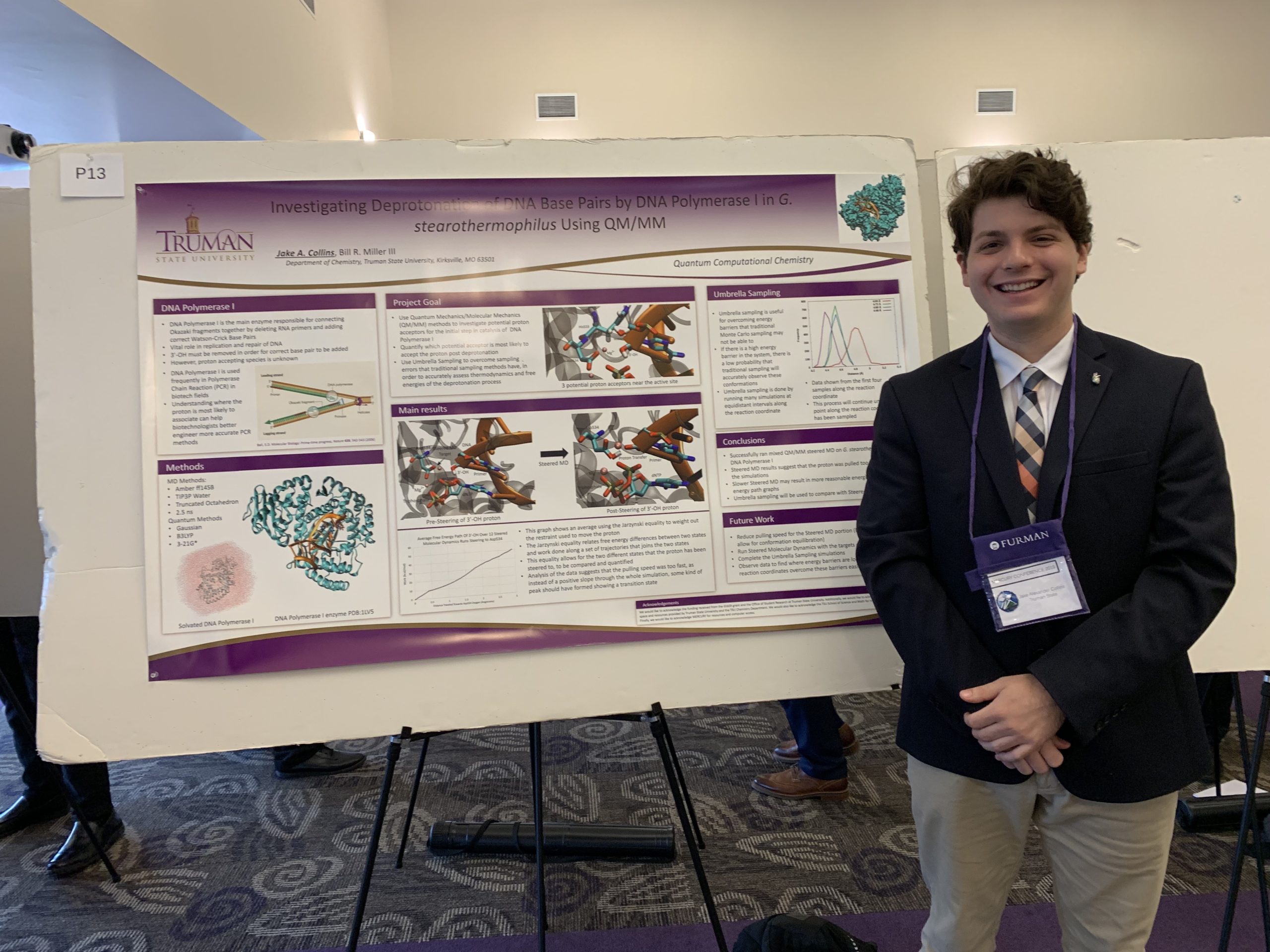 Jake in front of his research poster