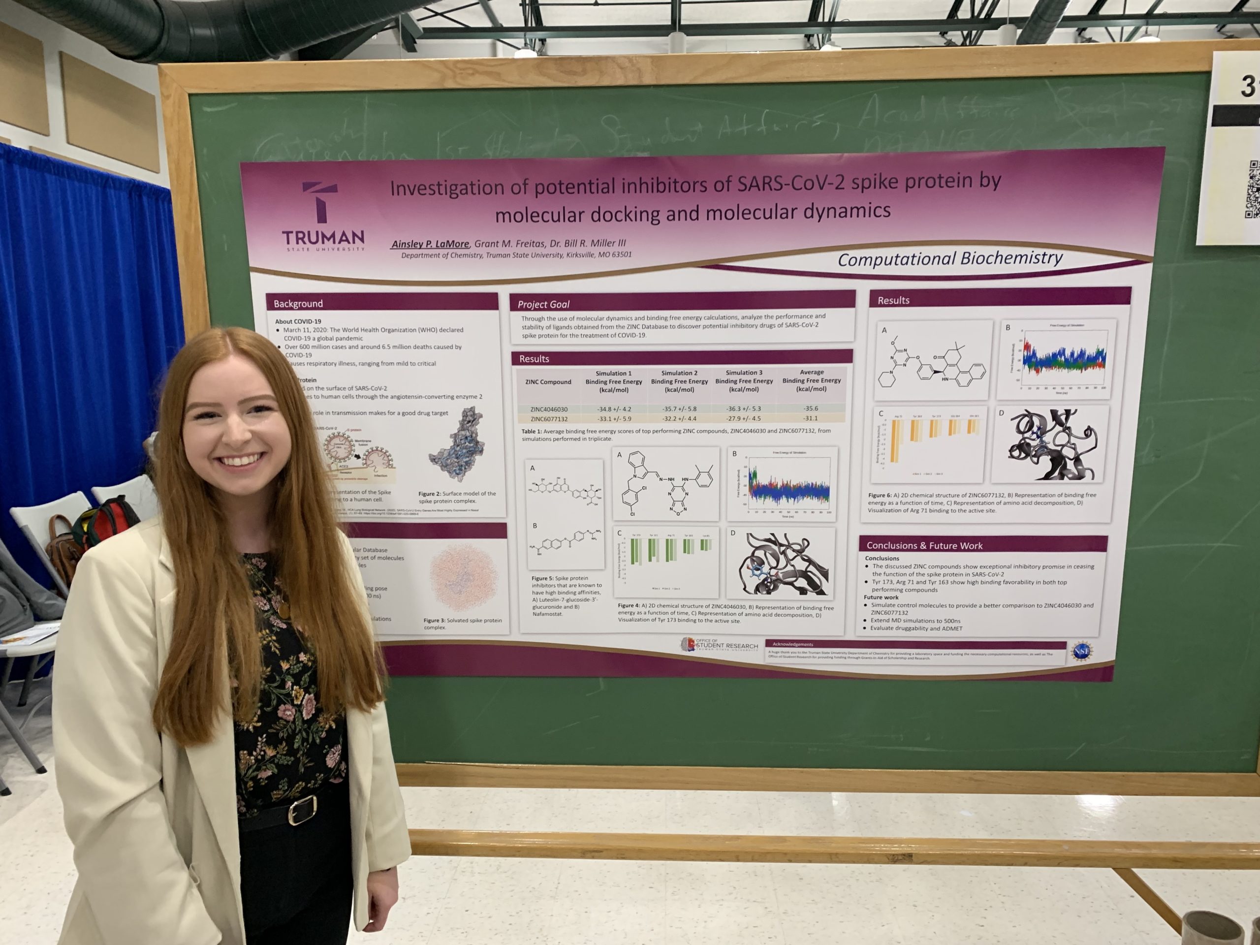 Ainsley in front of her research poster