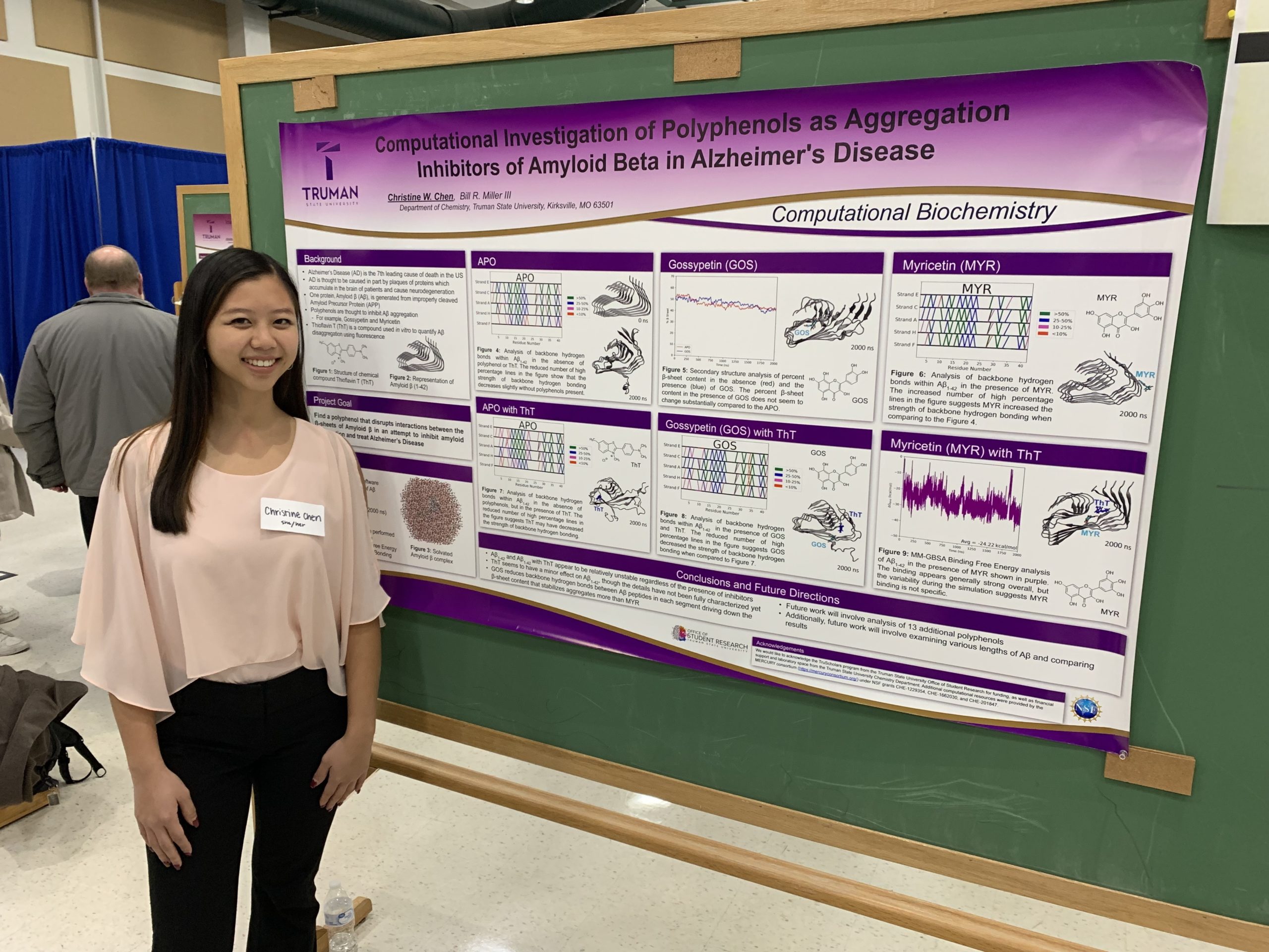 Christine in front of her research poster