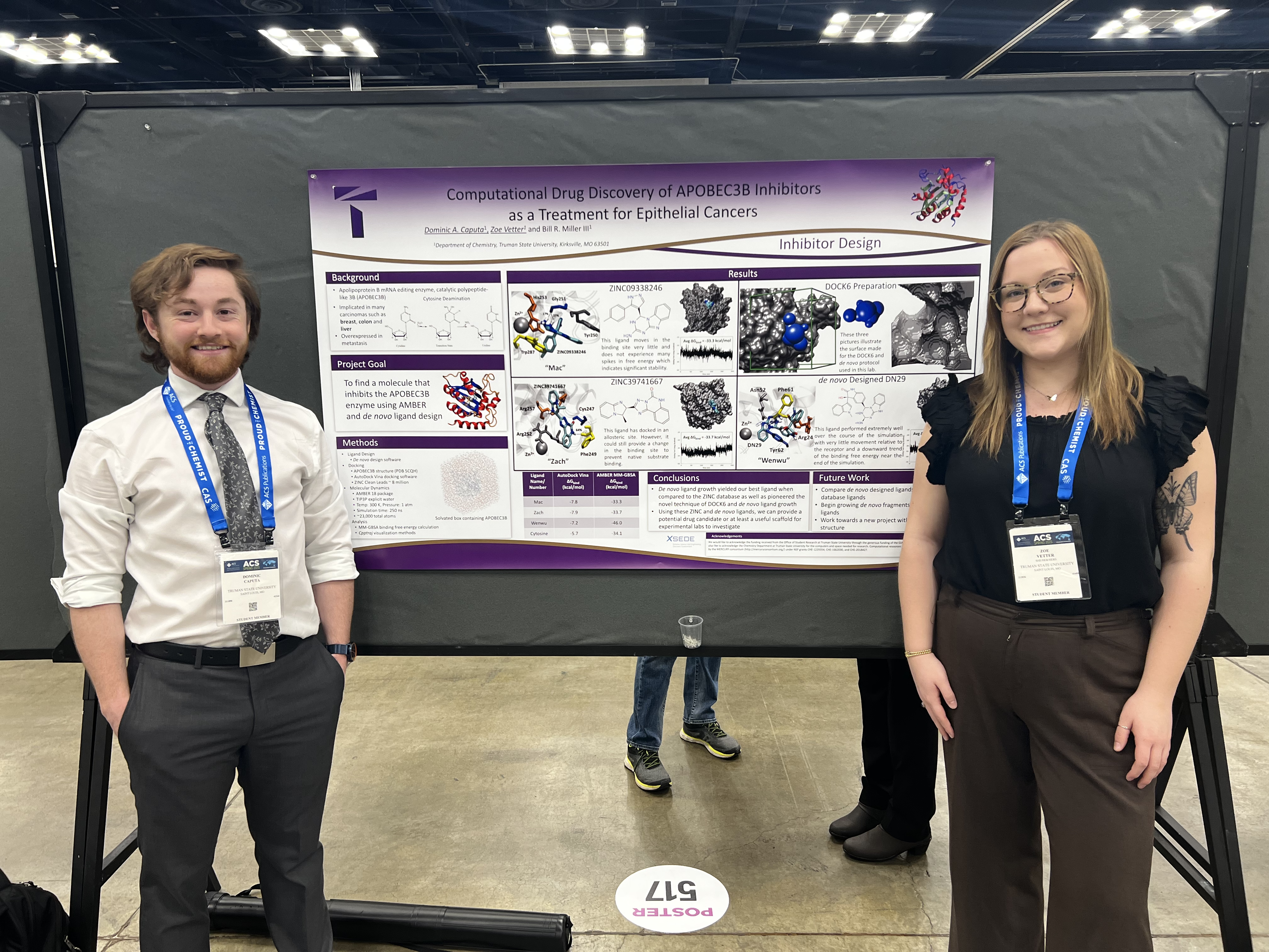 Dominic (left) and Zoe (right) in front of their poster on APOBEC3B