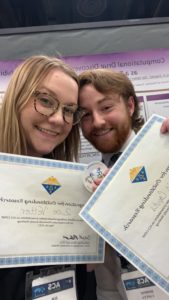 Zoe (left) and Dominic (right) with their award certificates for best undergraduate poster in the COMP division